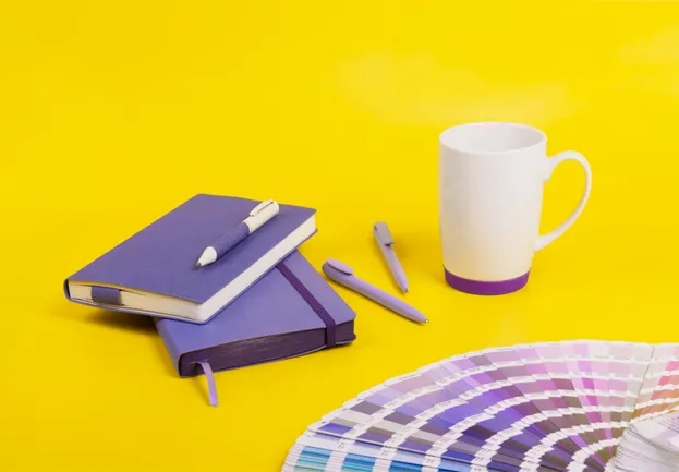 branded notebook, with a branded coffee mug 