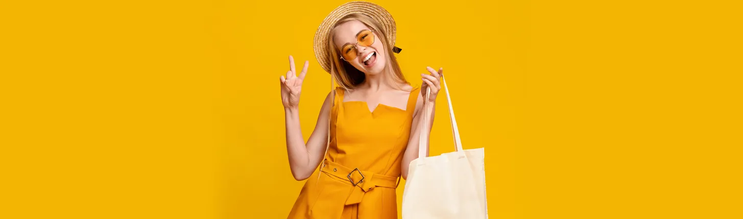 a young lady holding a branded tote from Ignition Marketing desktop hero image