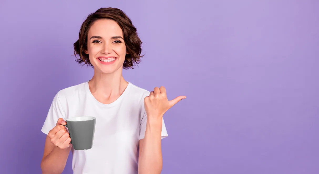a lady holding Ignition Marketing branded mug