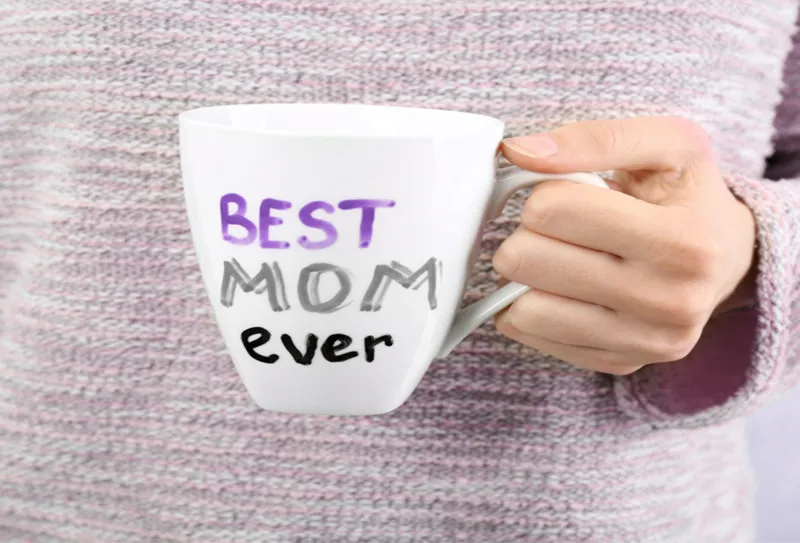 "best mom ever" promotional branded mug held up by a lady
