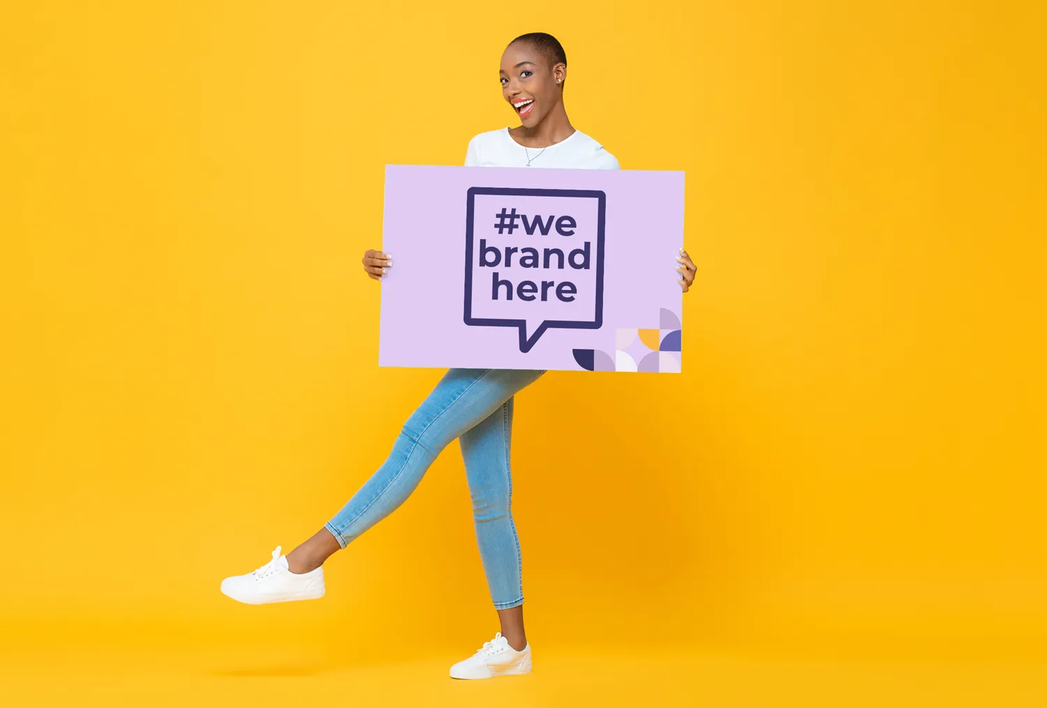 A lady holding a sign with Ignition Marketing's branding logo