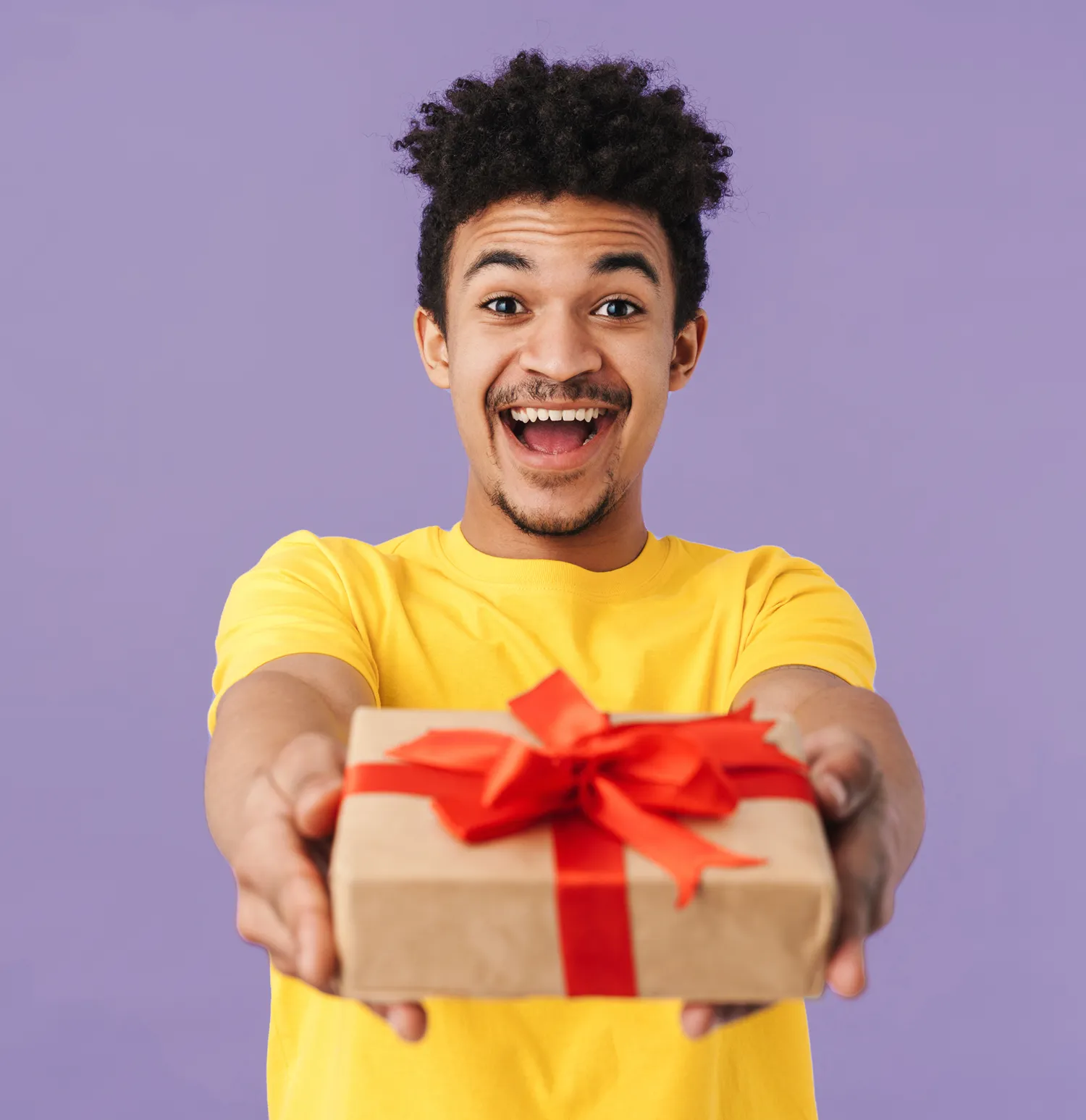 a man handing over a wrapped corporate gift box from Ignition Marketing 