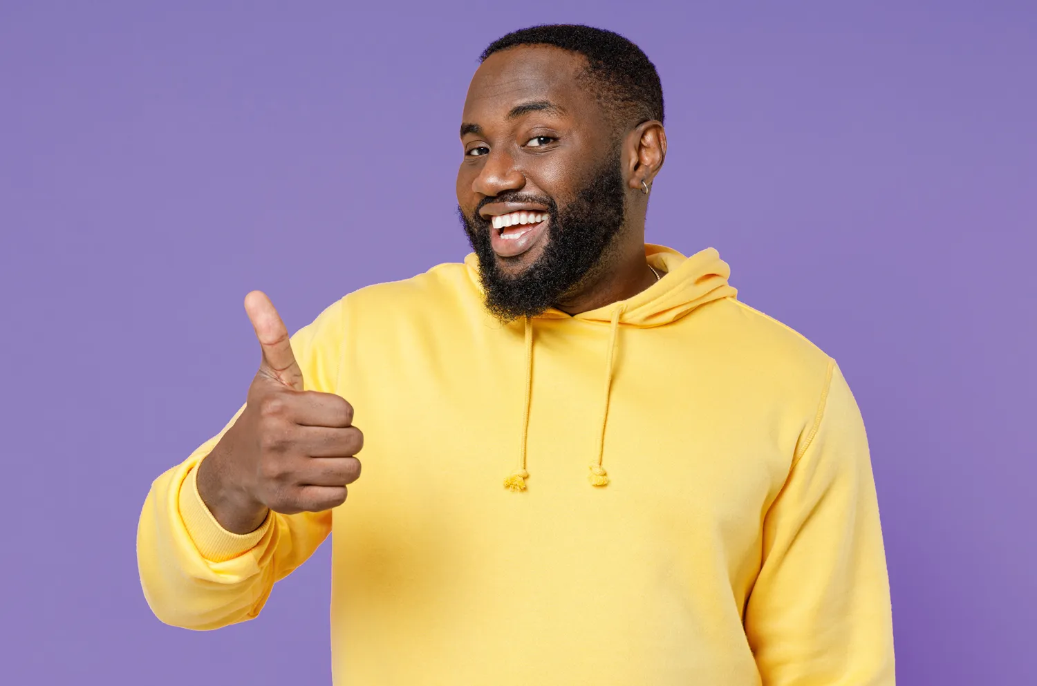 A man with a branded hoodie from Ignition Marketing, with a thumbs up sign