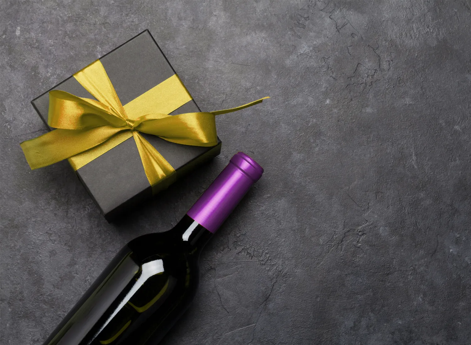 Corporate gifting featuring personalized wine bottle and wrapped gift box