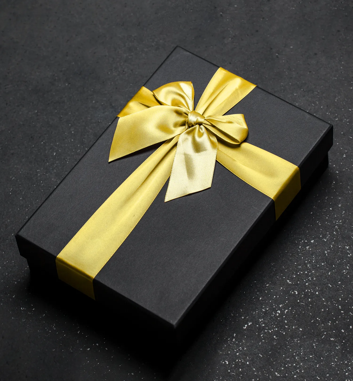 Corporate gift hamper box wrapped in a golden ribbon