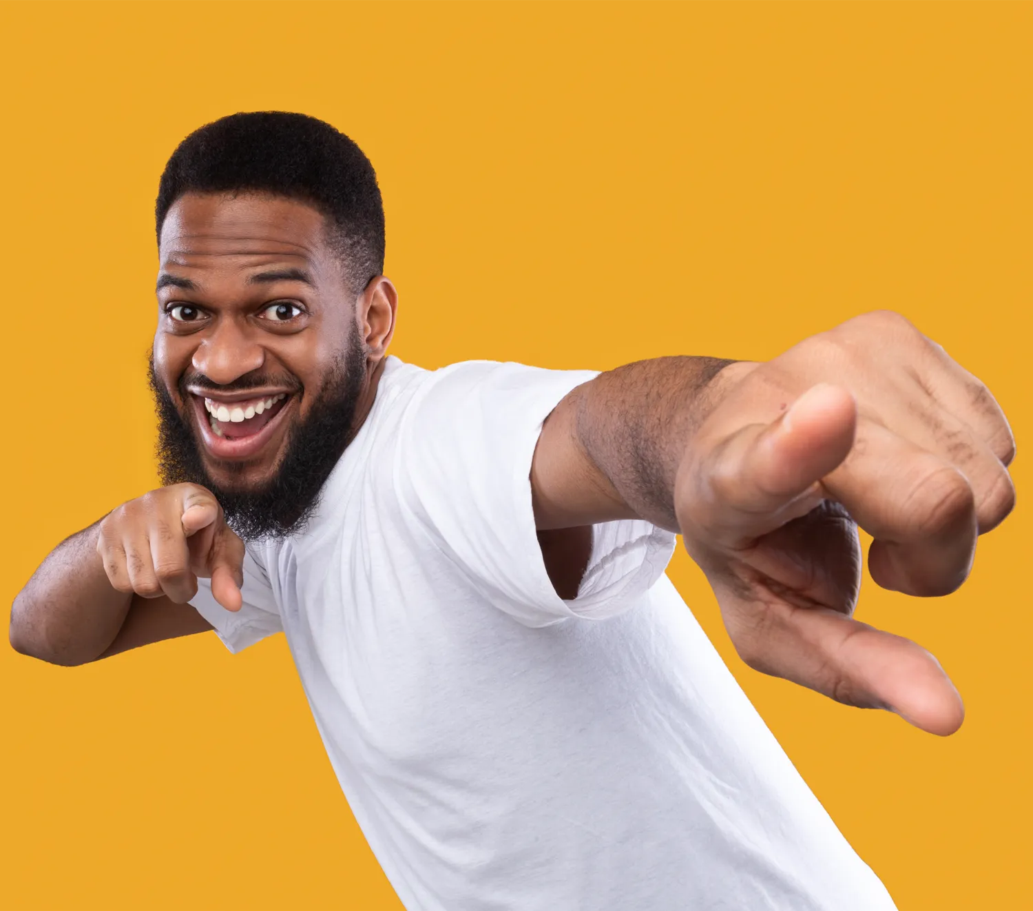 a man who looks happy and is pointing at the camera