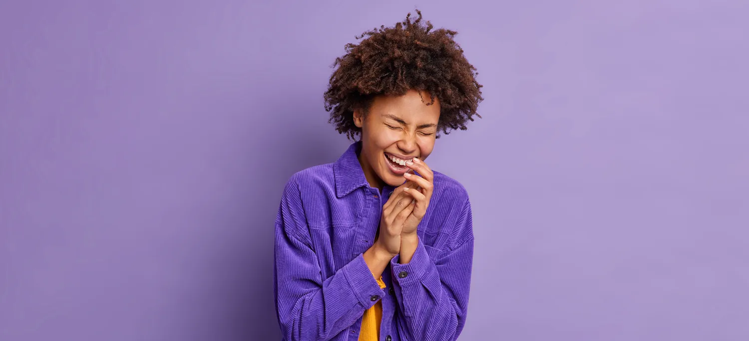a woman laughing when Ignition Marketing branded clour shirt