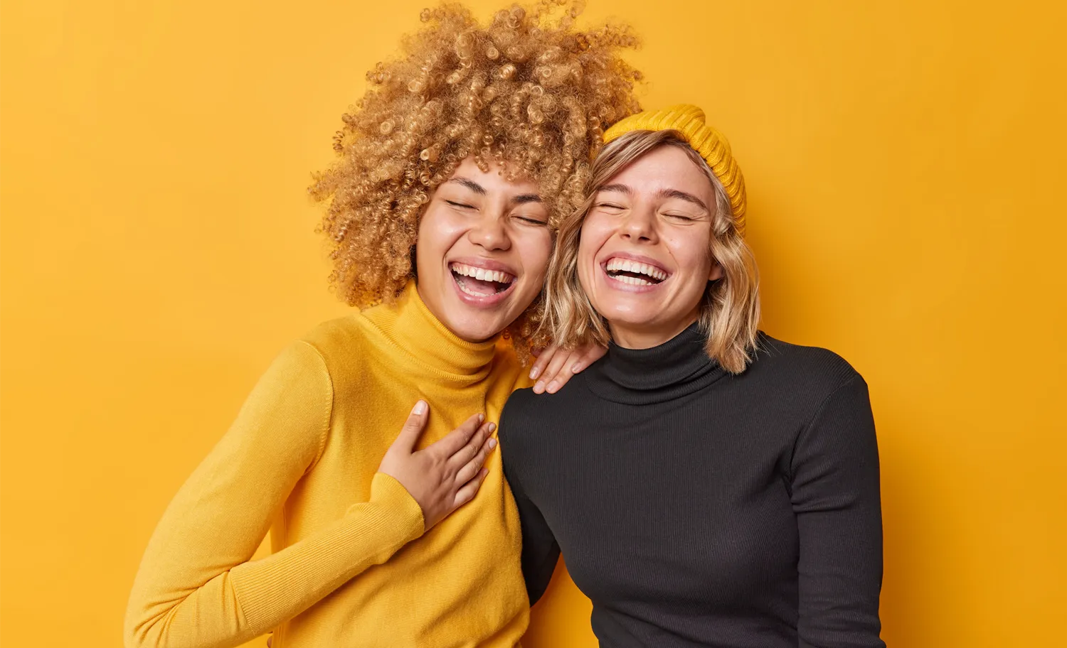 2 women laughing together